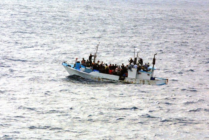 Refugees on a boat, photograph courtesy of U.S. Navy, licence CC0 1.0