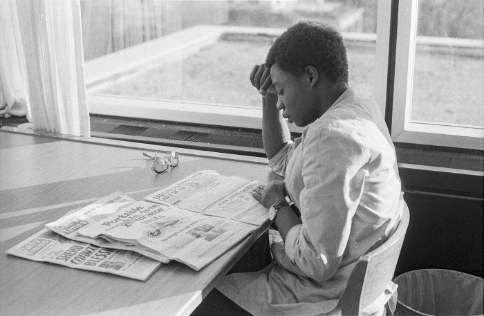 Young woman reading newspaper at Ohio Univeristy, 1980, photo courtesy of Ohio University Libraries, licence CC BY-NC-ND 2.0
